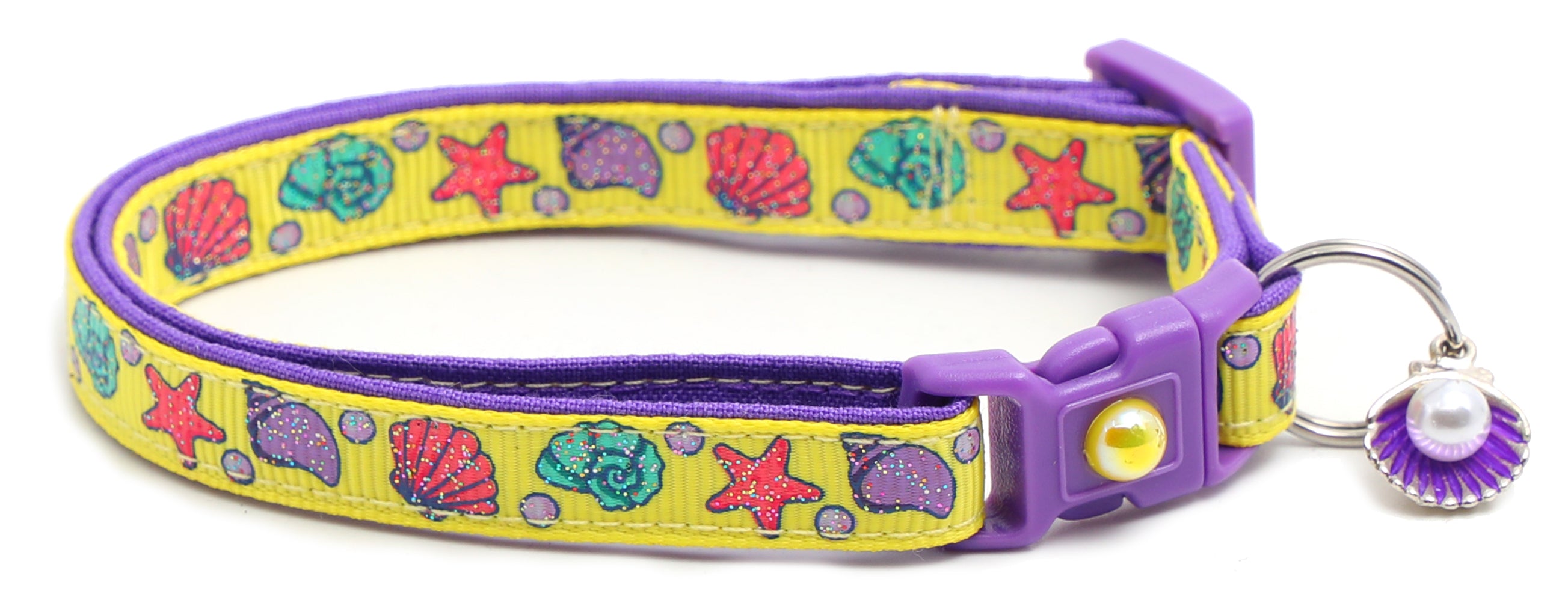 Beachcomber Breakaway Cat Collar in vibrant colors, featuring a breakaway clip and removable bell, made from soft reinforced cotton.